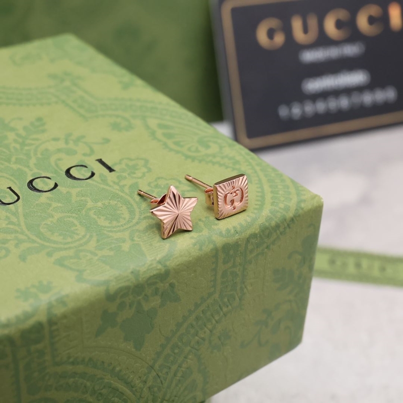 G*u*i earrings